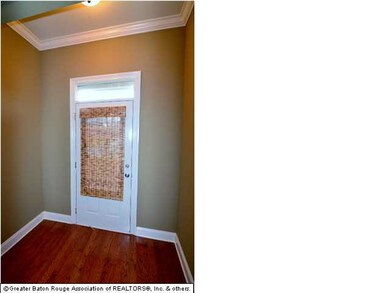 Nice foyer with crown molding and wood floors welcomes you into this great home with neutral colors throughout-view from Living Room