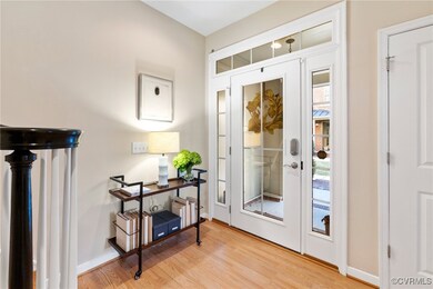 Doorway to outside with light hardwood / wood-styl