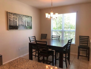 Dining room with light tile patterned floors and 