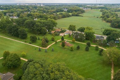 This home sits across from an open field and park 