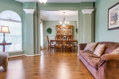 Formal living area opens onto dining room.