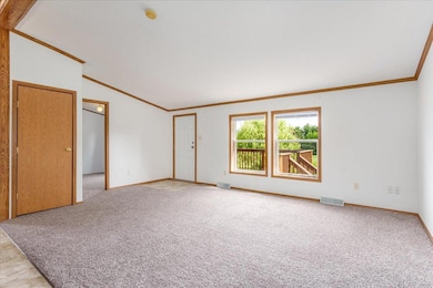 Bright light, high ceilings make this living room feel extra spacious