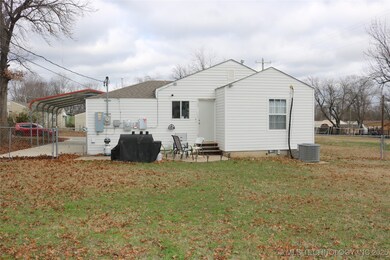 A view of the rear of the house.  Vinyl siding mak