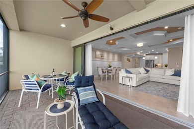View of patio with an outdoor hangout area, ceiling fan, outdoor dining area, and living area