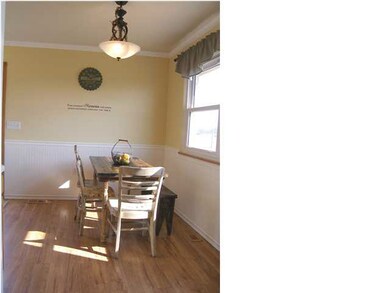 The dining area is enhanced by the updated light f