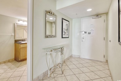 Entryway featuring light tile patterned flooring