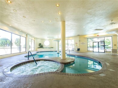 View of pool featuring a pool with connected hot 