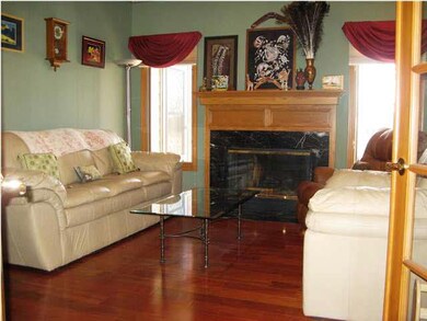 Formal living room with fireplace and Brazilian ch