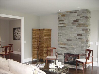 graced by a floor-to-ceiling stone fireplace!