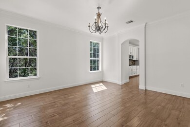 Spare room with arched walkways, plenty of natura