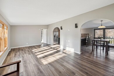Bright and open living room. Check out the archways!