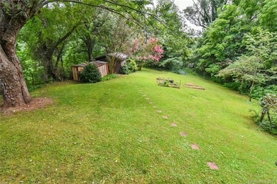 View from covered rear deck of huge usable back ya