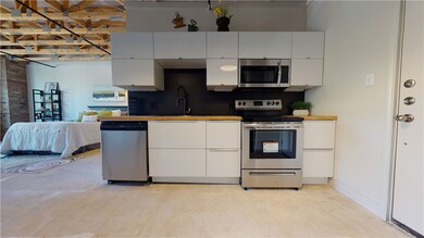 Kitchen with a sink, stainless steel appliances, c