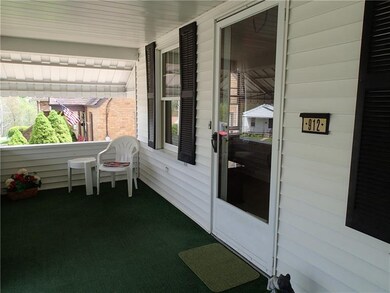 Charming front covered porch to relax!