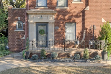 Doorway to property featuring brick siding