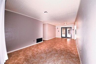 Living with french doors leading to the patio