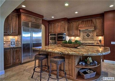 Goumet kitchen features granite, stone backsplash,