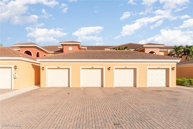 Mediterranean / spanish-style home with a garage