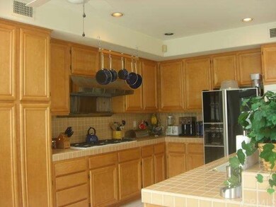 Spacious kitchen  custom maple  cabinets.