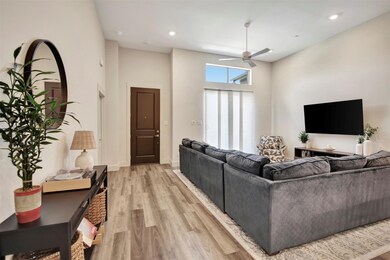 Entry wa and living room featuring light wood-type