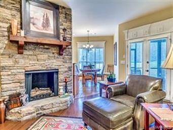 Rich hardwood floors stone gas fireplace. Massive 