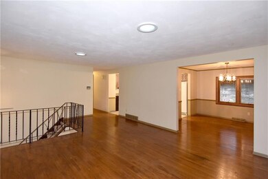 The spacious living room offers a bay window and a