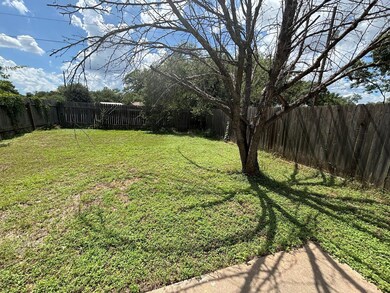 View of fenced backyard