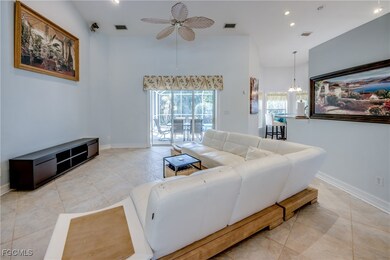 Living area with ceiling fan, high vaulted ceiling
