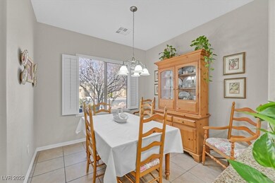 Dining area with baseboards, light tile patterned