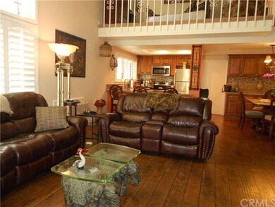 Open floor plan with vaulted ceiling