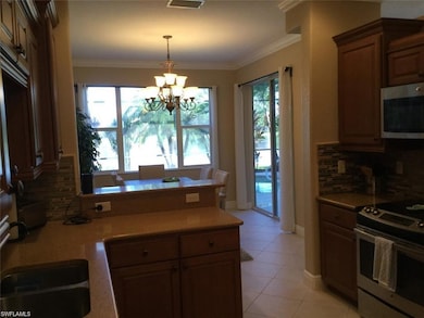 Kitchen with crown molding, decorative backsplash,