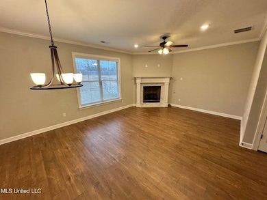 Unfurnished living room featuring visible vents, o