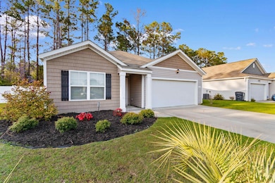 Single story home with a front yard, concrete driv