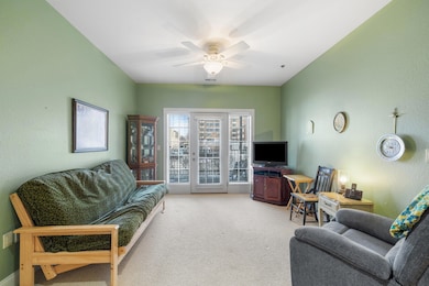 Living Room with door to outdoor covered
