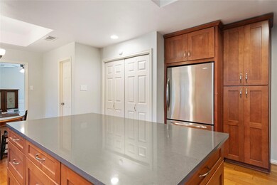 Oversized kitchen island provides a place for dinn