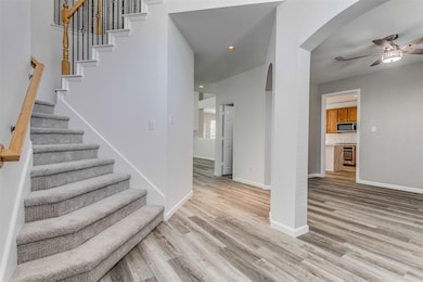 Welcome home! The entry has soaring ceiling to the second floor, great natural light, updated light fixture and fantastic flow to the rest of the home.