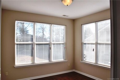 This sunny flex space on the main level could func