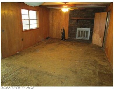 Exterior Front. Den area with fireplace.