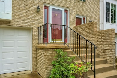 Welcome guests to your home at the pristine front door featuring sidelights flooding the foyer.