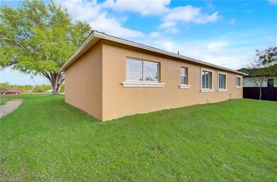 Rear of home with a abundan.ce of property