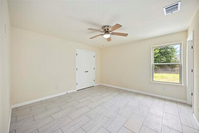Natural light streams in this bedroom, illuminatin