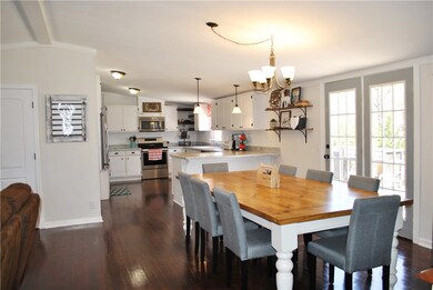 Large dining space looking into the kitchen and ac