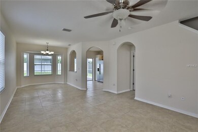 Family and dining room with tile