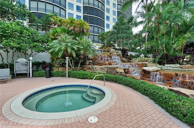 View of pool featuring a hot tub