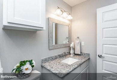 Bathroom with toilet and vanity