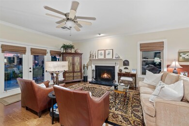Living area with ornamental molding, light wood-s