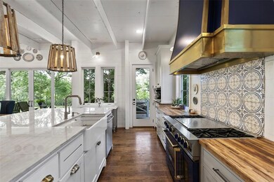 This chef's delight kitchen boasts a 6-burner gas 