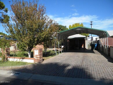Paved Driveway with Custom Carport