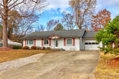 Driveway with ample parking and 1 car garage