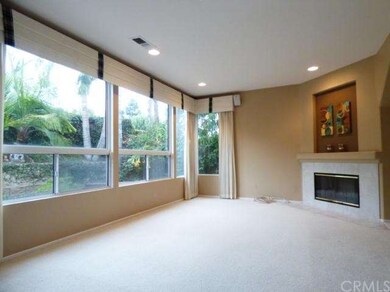 Spacious family room with a fireplace and a view o